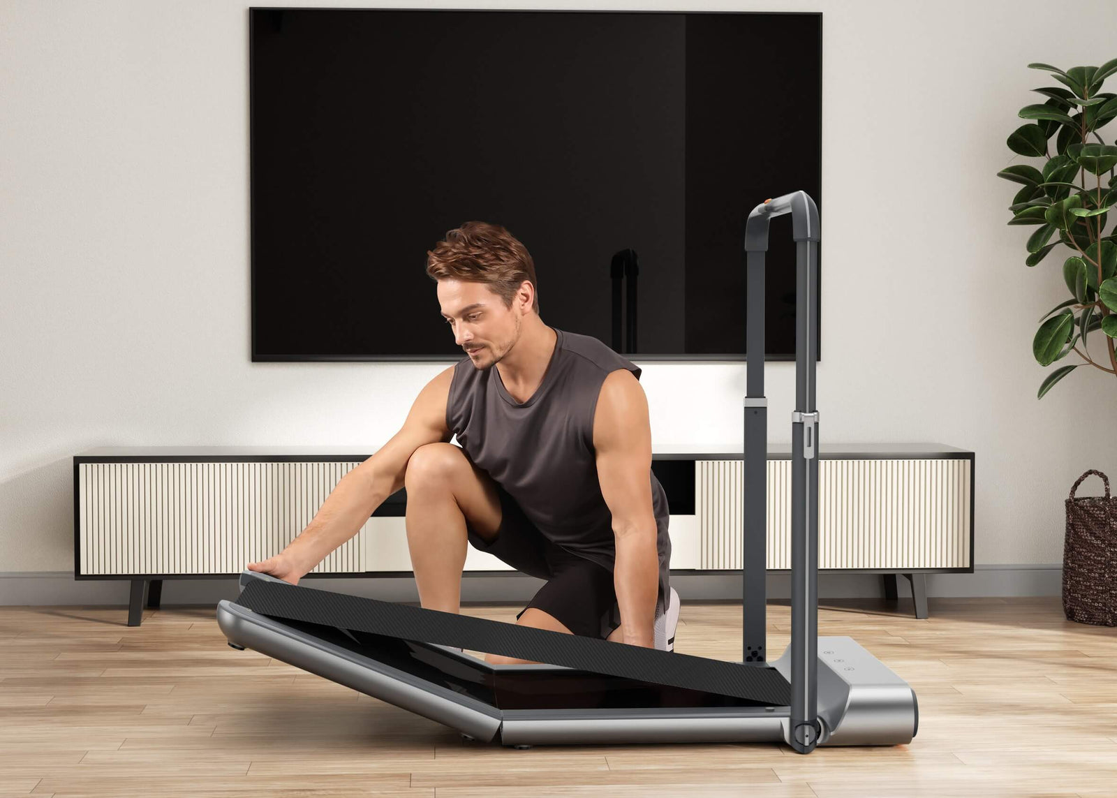 Folding the foldable treadmill