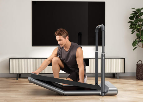 Folding the foldable treadmill