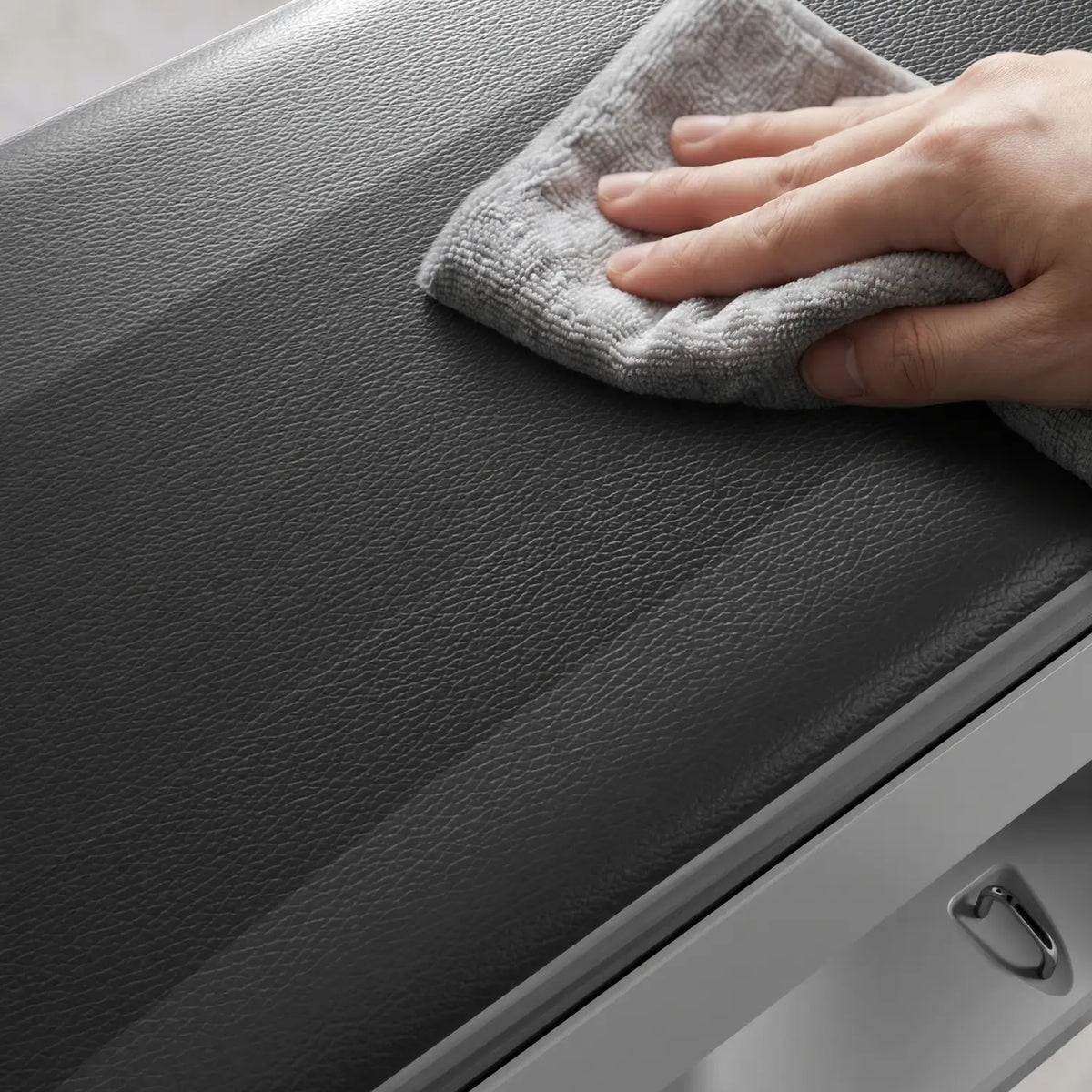 [scene] Close-up of a cloth wiping down the padded surface of the KingSmith B1 weight bench
